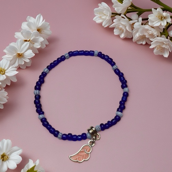 Handmade Jewelry - Cobalt Blue Beaded Bracelet with Pink Wing Charm